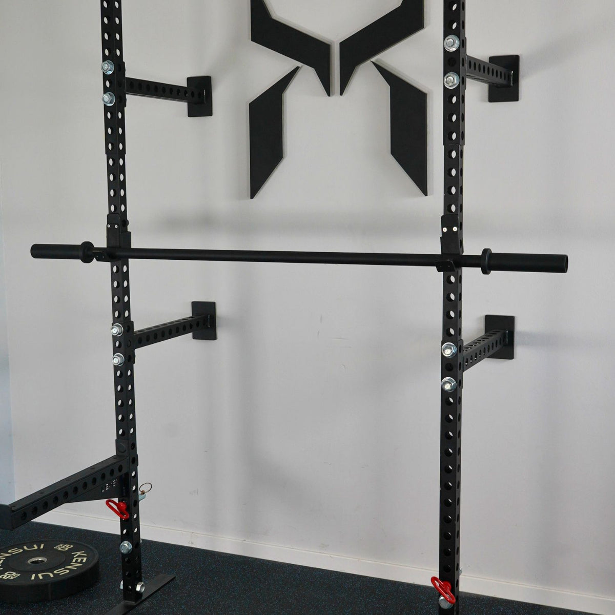 Toyama training bar resting on a power rack