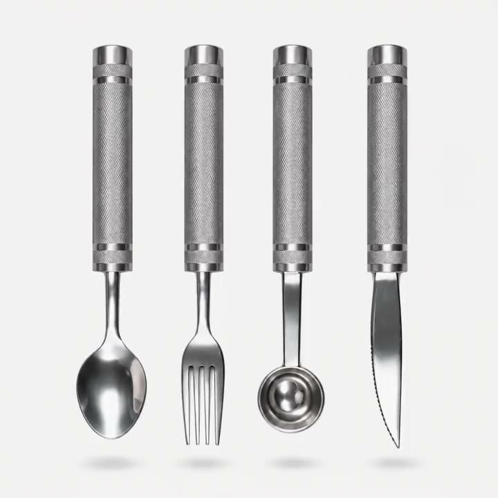 HeavyLift weighted spoon, fork, protein scoop, and knife hovering above soft shadows