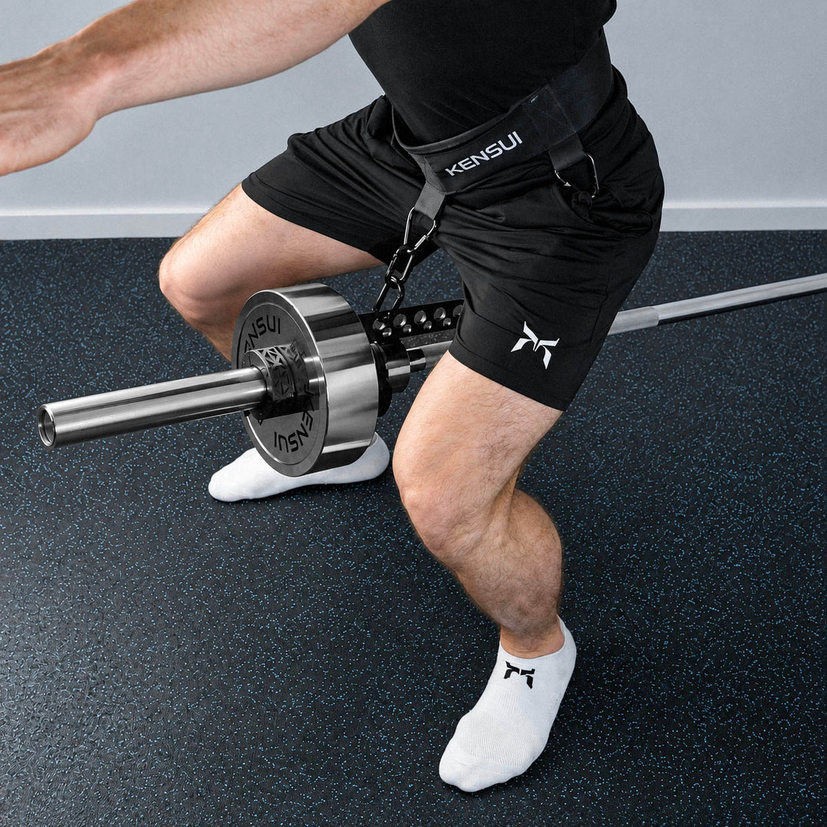 Athlete performing a landmine belt squat