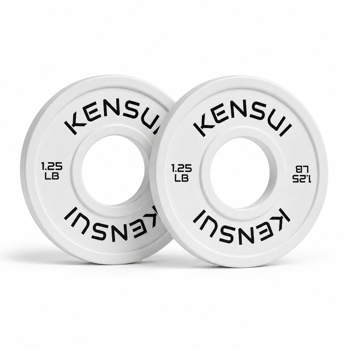 Pair of Kensui white 1.25 lb rubber change plates with black lettering on a white background