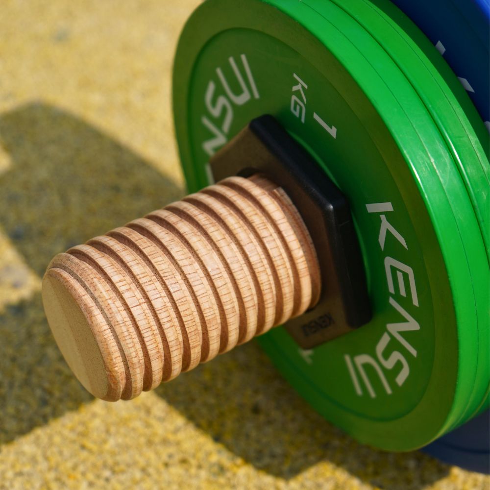 Close-up of the Timber prototype wooden threads and black collar securing weight plates