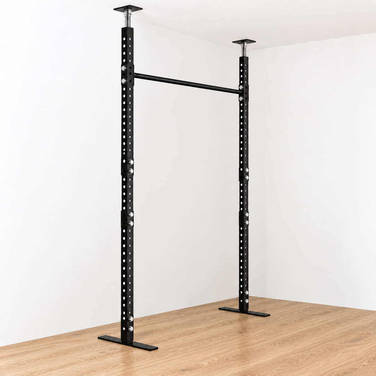 Angled front and side view of the black Torii exercise bar with telescoping jack posts touching a white ceiling, on a wooden floor.