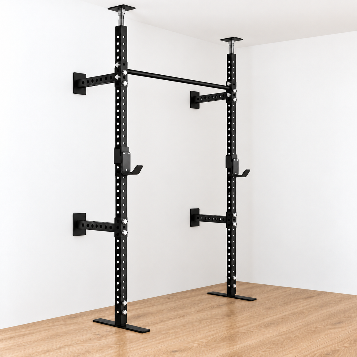 Angled front and side view of the black Torii rack with ceiling jack posts, four wall supports and two J-cups, in a white room with an oak floor.