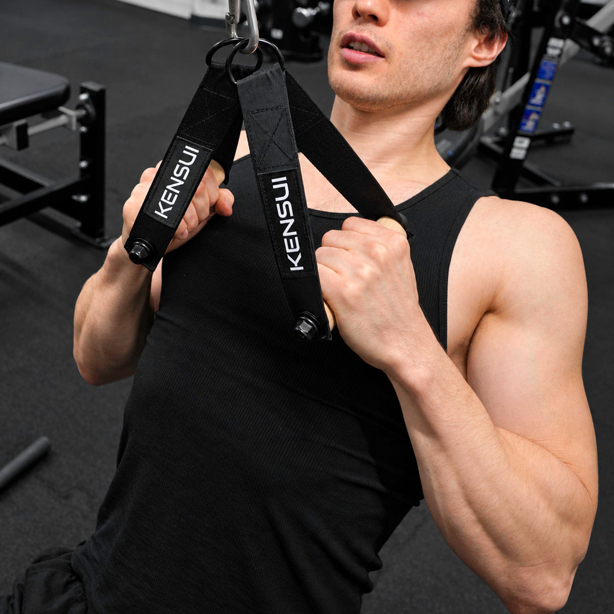 Close-up of Kensui Woody Handles with wooden grips during a cable pulldown