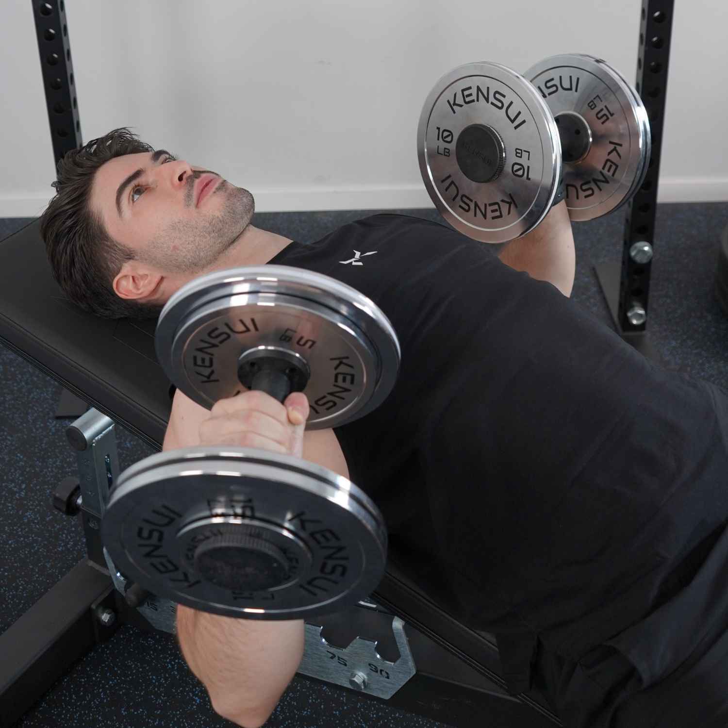 
Person performing an incline dumbbell press.