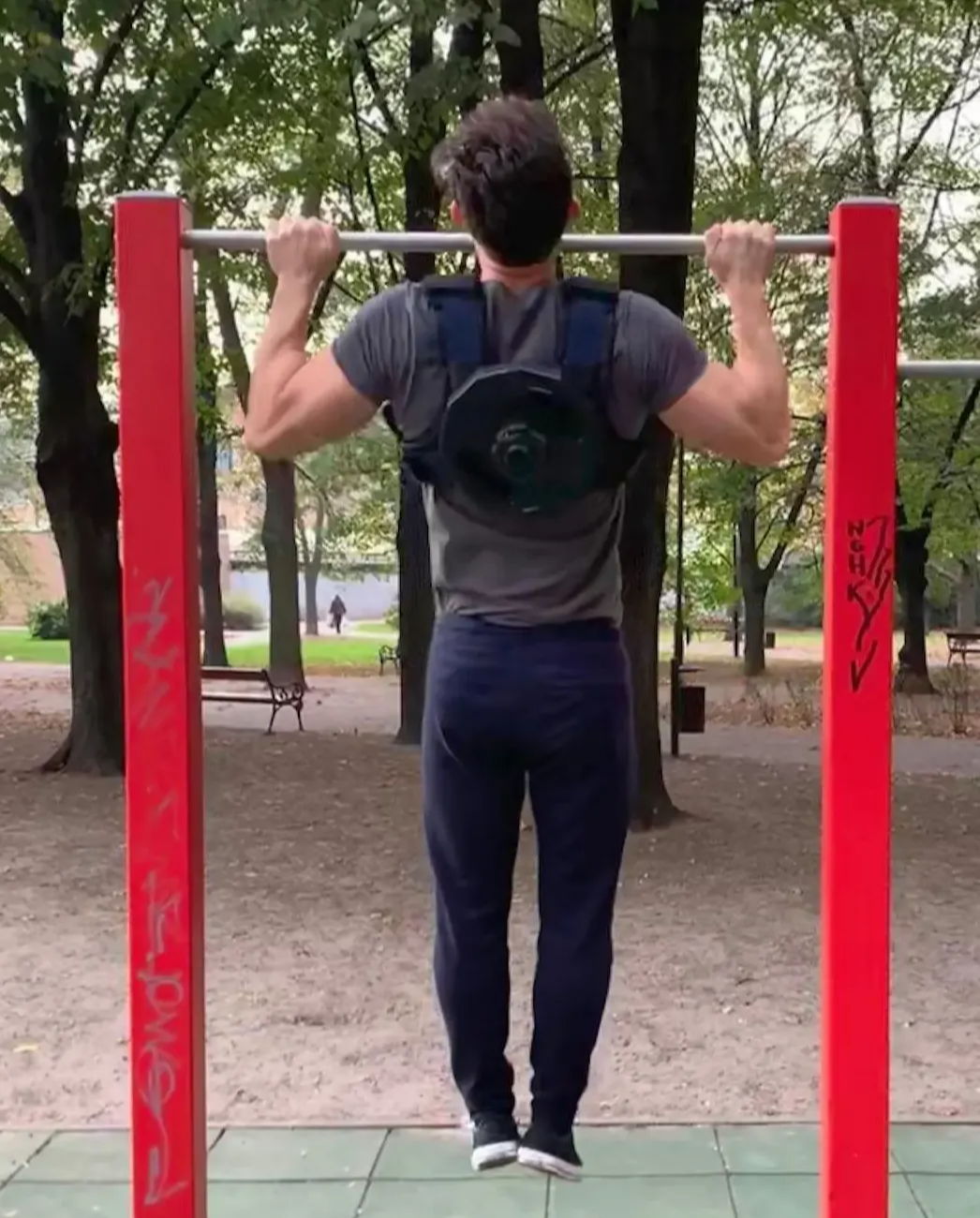 performing pullups with weight vest