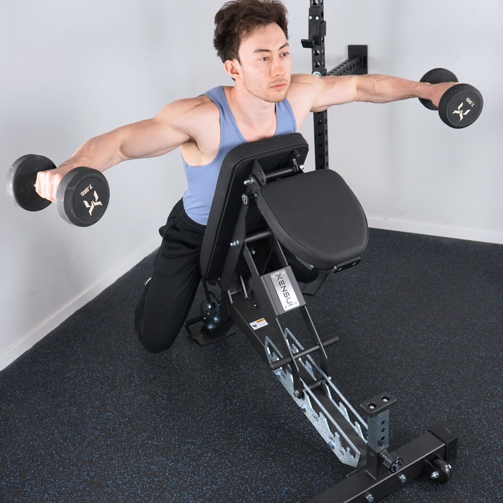 Man doing chest-supported dumbbell reverse flyes on an incline bench.