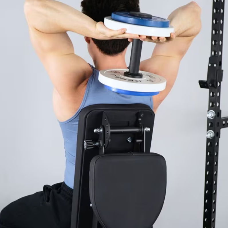 Rear view of a man performing an overhead dumbbell triceps extension while seated on an incline bench.