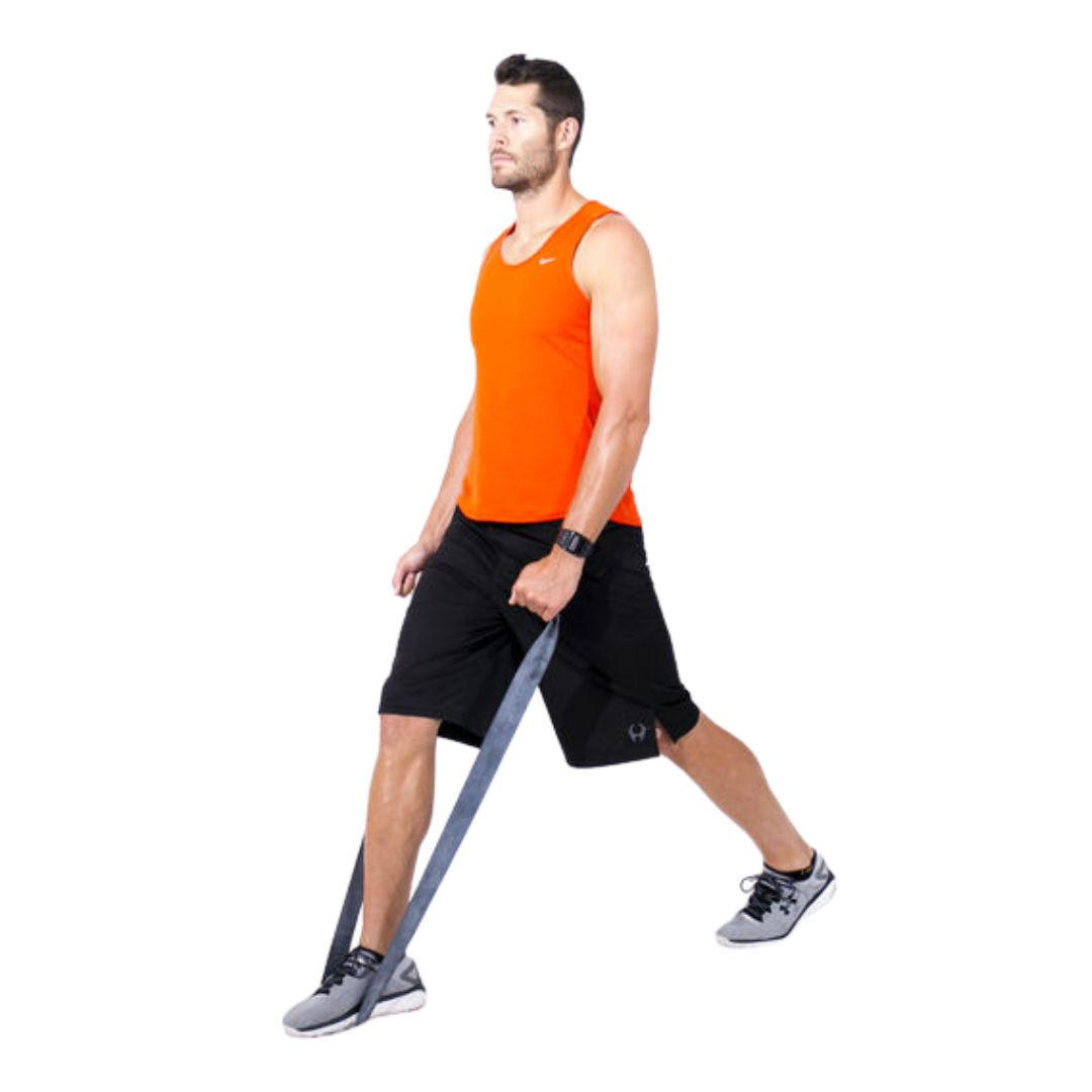 Person standing in a split stance with a resistance band.